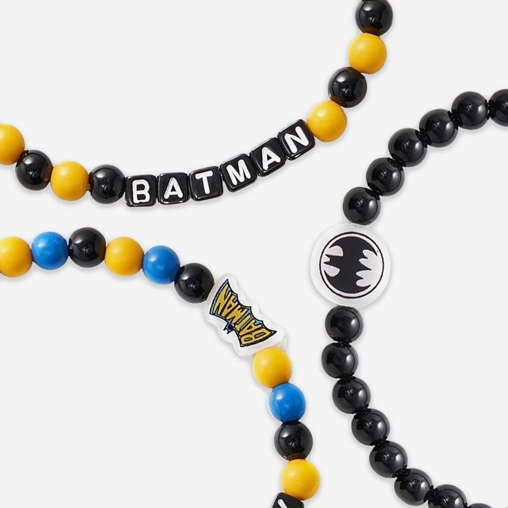 Step up your fan fashion sense with this Batman DC 3 Pack Beaded Friendship Bracelet. These matching friendship bracelets have an all-over design and thematic displays, which makes them the perfect way to show your support for Batman and show off your unique sense of style. Every bead bracelet design is the perfect addition to your outfit, whether you’re out and about, watching TV at home, or just hanging out with friends. With thematic word displays and accents, you can focus on showing off you Trendy Black Plastic Bracelets, Novelty Black Friendship Bracelets, Trendy Plastic Jewelry For Friendship, Novelty Bracelets With Letter Beads, Themed Adjustable Friendship Bracelets With Letter Beads, Themed Round Beaded Bracelets For Friendship, Plastic Beaded Friendship Bracelets, Casual Plastic Wristband Gift, Personalized Fun Black Beaded Bracelets