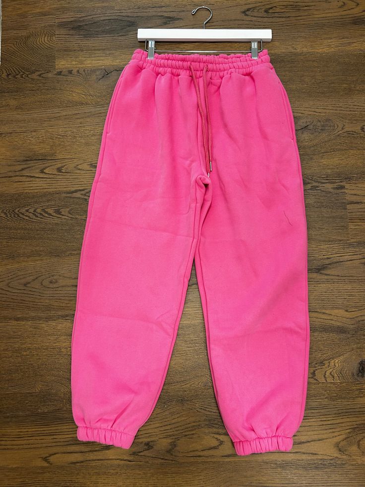 Barbie pink baggy pants Trendy Pink Parachute Pants, Trendy Pink Parachute Pants For Streetwear, Trendy Pink Pants With Pockets, Trendy Pink Parachute Pants With Side Pockets, Trendy Pink Parachute Pants With Pockets, Pink Parachute Pants With Pockets For Streetwear, Pink Parachute Pants With Elastic Waistband For Streetwear, Pink Wide Leg Parachute Pants For Streetwear, Trendy Pink Full-length Parachute Pants