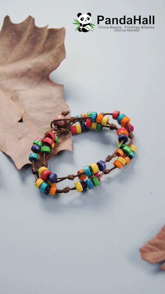 a bracelet with multicolored beads on it next to an autumn leaf and pandahalli logo