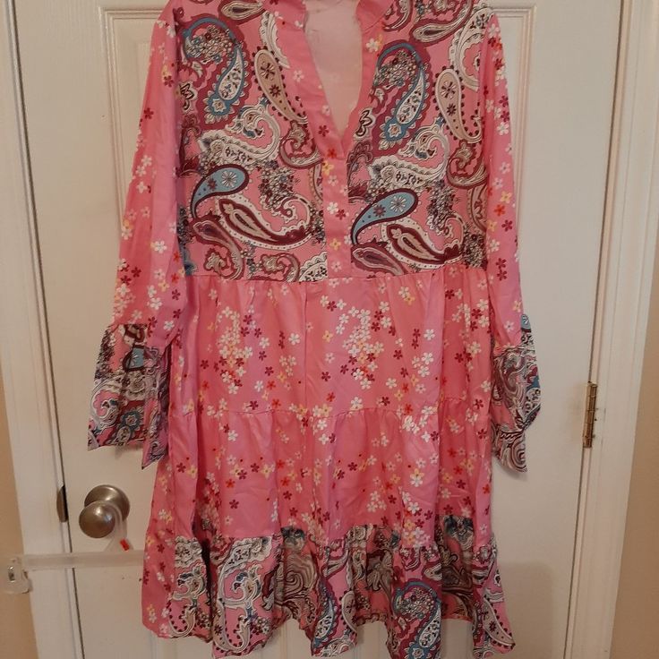 Nwot Paisley Dress In Pink With Small Flowers. Size Is A Large And Is 100% Polyester. Light Weight Material Great For Those Summer Days. Would Also Make A Great Coverup For You Swimsuit. Spring Patterned Dresses With Ruffle Hem, Patterned Spring Dresses With Ruffle Hem, Patterned Dress With Ruffle Hem For Spring, Pink Shift Midi Dress For Spring, Patterned Long Sleeve Dress For Day Out, Pink Paisley Print Mini Dress For Summer, Spring Paisley Print Mini Dress, Spring Pink Paisley Print Mini Dress, Pink Mini Dress With Paisley Print For Summer