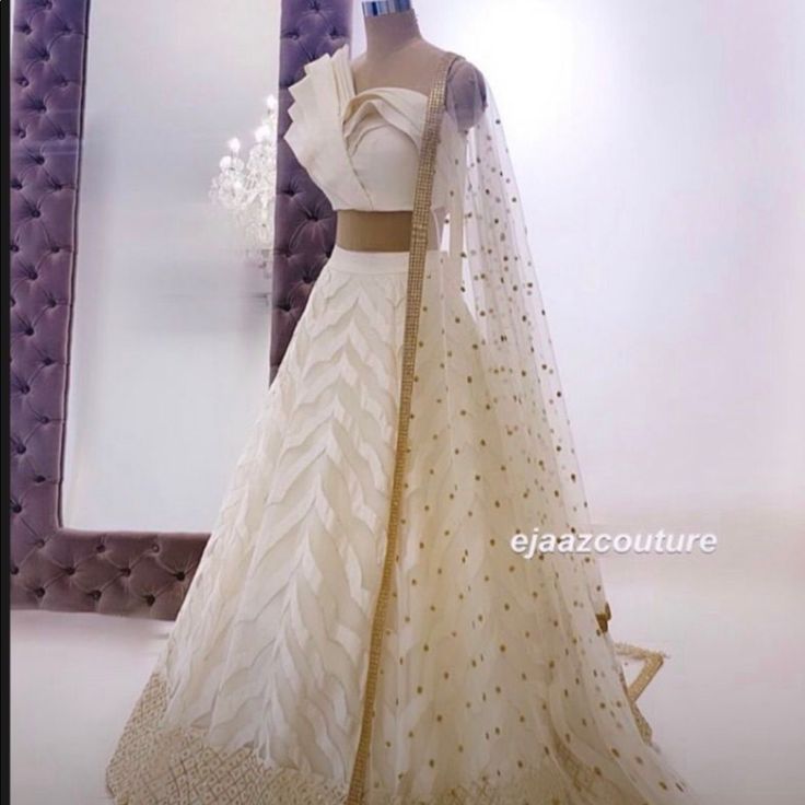 Beautiful Cream Lehenga With Unique Blouse And Full Skirt Ideal For A Size 4/6 Never Worn (Only For Photos ) Didn’t End Up Using For My Wedding Elegant Designer White Lehenga, Elegant White Designer Lehenga, Elegant White Choli With Sheer Dupatta, Elegant White Lehenga With Sheer Dupatta, Elegant Fitted Organza Lehenga, Elegant Fitted Skirt With Zari Work, Elegant Fitted Organza Choli, Elegant Festive Skirt With Sheer Dupatta, White Organza Lehenga For Formal Occasions