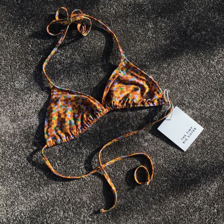 The Tiny Big Sister Flowers Bikini Top Nwt Floral Print Triangle Bikini Top. Halterneck And Back Tie Strap. So Very Lovely, Sadly Not The Right Size For Me. Exterior: 80% Polyamide, 20% Elastane Lining: 92% Polyester, 8% Elastane Size Eu 40 (Us 8/L) Orange Fitted Swimwear For Festival, Orange Halter Neck Swimwear For Sunbathing, Fitted Orange Swimwear For Festivals, Orange Beachwear Halter Top For Poolside, Orange Halter Top For Poolside Beachwear, Festival Fitted Orange Swimwear, Orange Halter Top For Poolside, Orange Triangle Halter Top For Beachwear, Orange Festival Swimwear