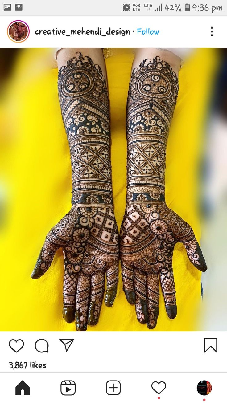 two hands with henna designs on them