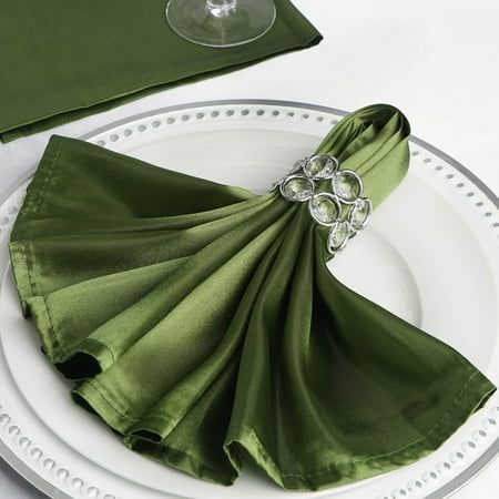 an image of a place setting with green napkins