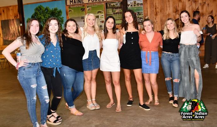 a group of women standing next to each other