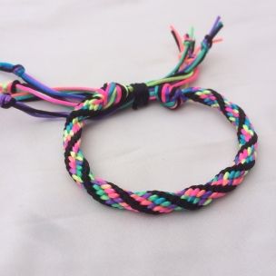 multicolored rope bracelet on white background