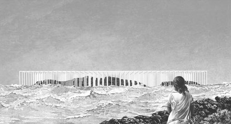 a man standing on top of a rocky beach next to the ocean