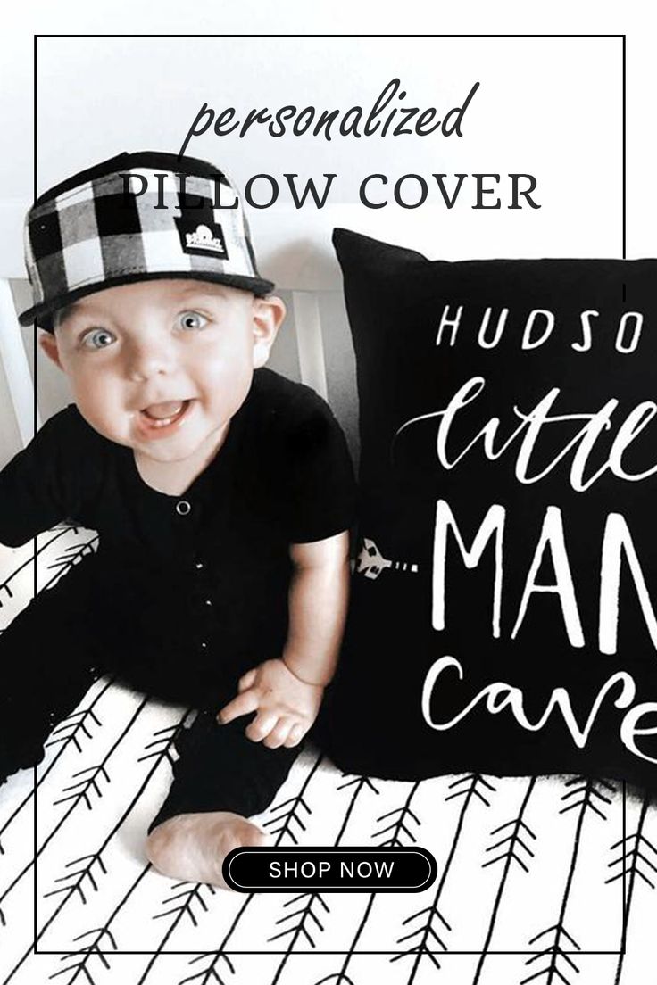 a black and white photo of a baby wearing a hat with the words, hug so little man cave on it