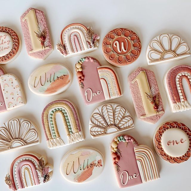 decorated cookies are arranged in the shape of letters