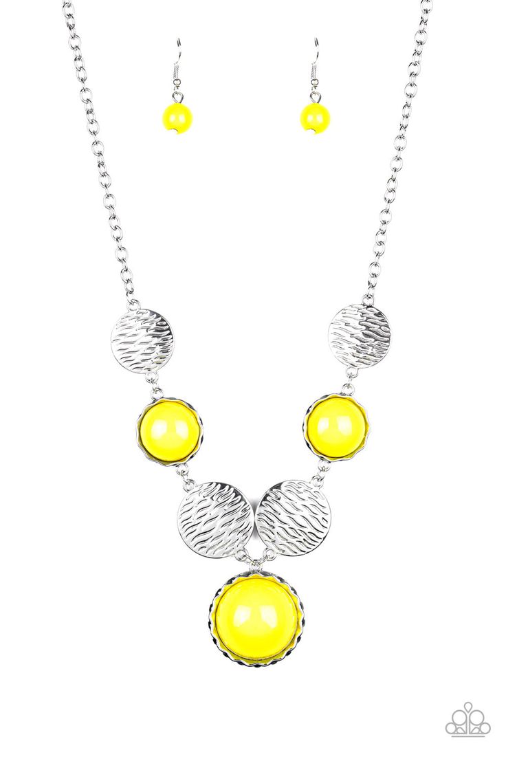 Embossed in wavy textures, shiny silver discs link with bubbly yellow beaded frames below the collar, creating a colorful statement piece. Features an adjustable clasp closure. Sold as one individual necklace. Includes one pair of matching earrings. Get The Complete Look!Bracelet: "Boardwalk Boho - Yellow" (Sold Separately) Paparazzi Accessories Jewelry, Silver Strand, Bead Frame, Yellow Necklace, Bohemian Accessories, Jewelry Images, Paparazzi Accessories, Blue Gems, Disc Necklace