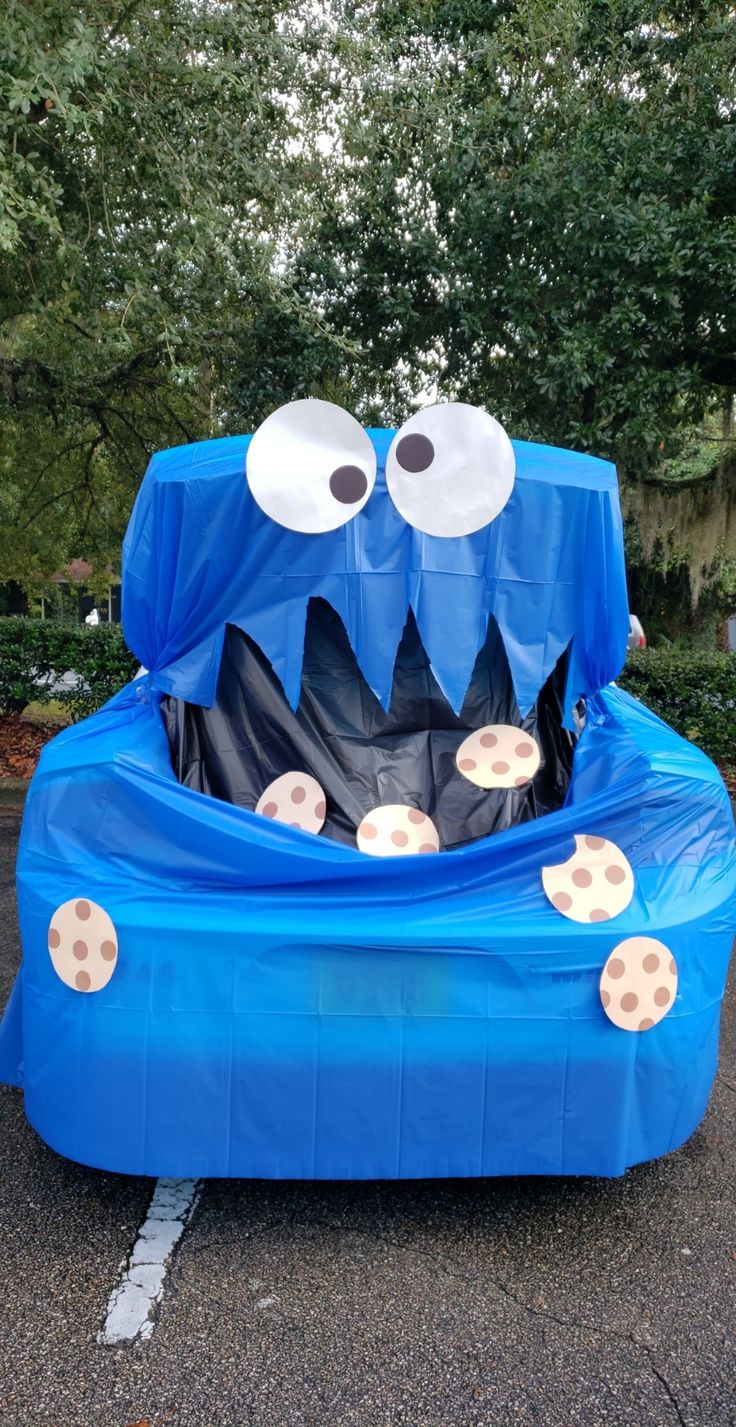 an inflatable bed with googly eyes and mouth on the top is shown