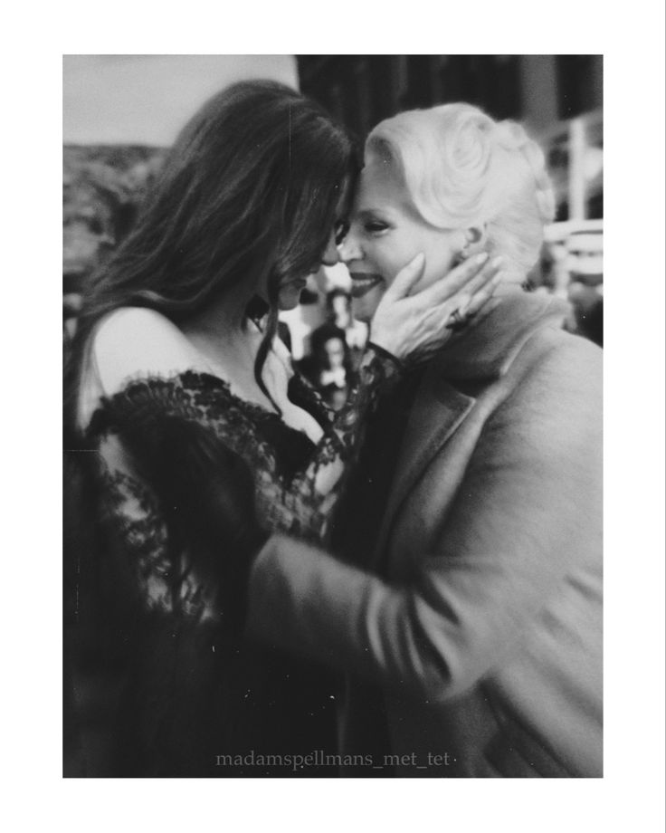 black and white photograph of two women embracing each other