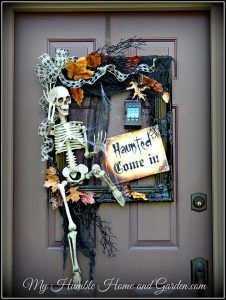 a door decorated with skeletons and leaves