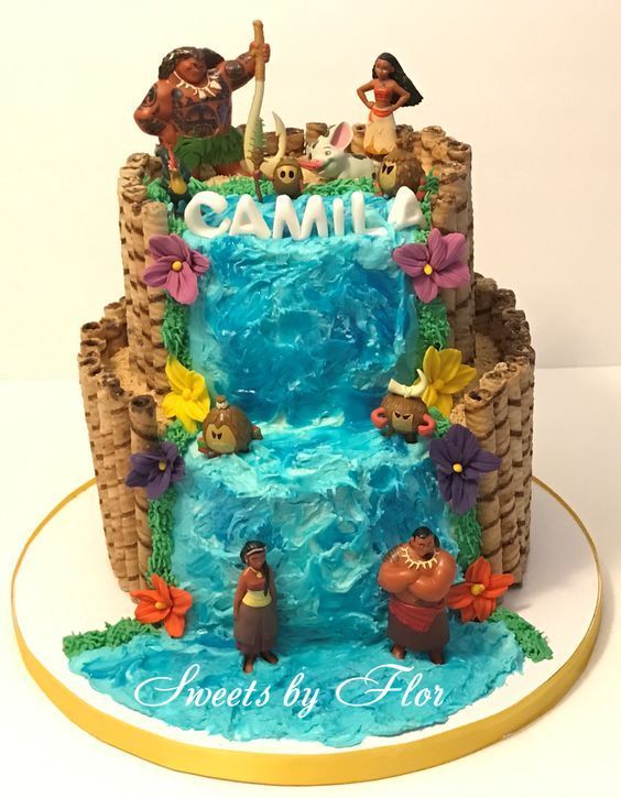 a cake that is made to look like the little mermaids are in front of a waterfall