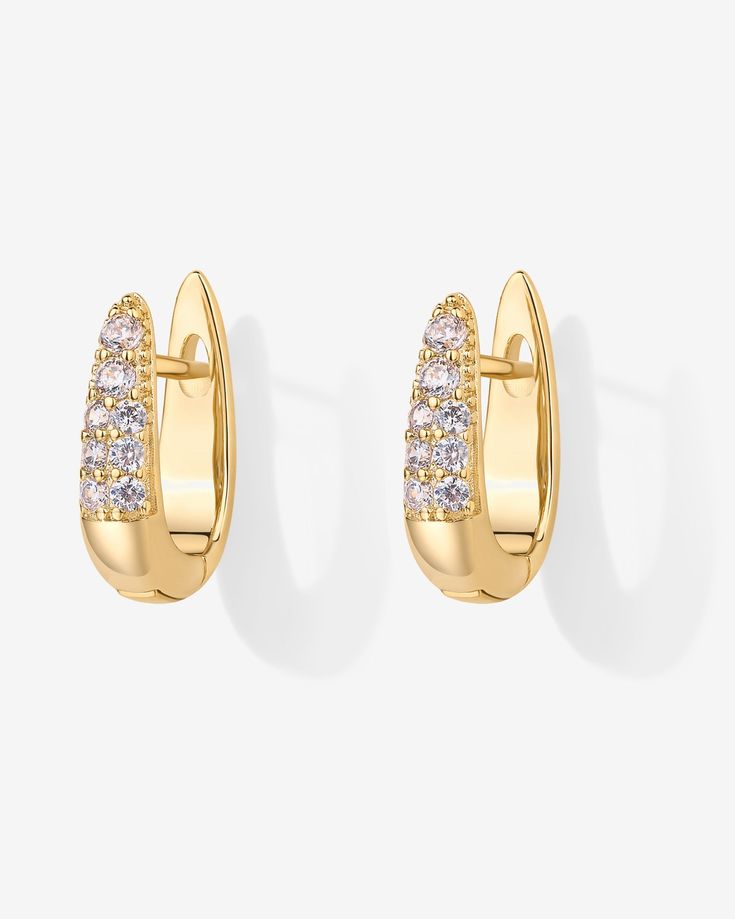 Elevate your style effortlessly with these chic earrings! Featuring stunning AAAAA cubic zirconia stones that catch the light just right, they add a touch of glam to any look, day or night. Materials: 925 sterling silver posts 18K Yellow Gold or Rhodium plated Measurements: Length: 16mm; Width: 4.5mm. Hypoallergenic, nickel free, and lead-free. Cubic Zirconia Huggie Earrings With Sparkling Stones, Modern Cubic Zirconia Earrings For Anniversary, Sparkling Cubic Zirconia Huggie Earrings, Elegant Everyday Huggie Earrings With Brilliant Cut, Elegant Huggie Earrings With Sparkling Stones For Wedding, Elegant Brilliant Cut Huggie Earrings For Everyday, Cubic Zirconia Huggie Earrings With Sparkling Stones For Gift, Classic Huggie Earrings With Cubic Zirconia, Gift Huggie Earrings With Sparkling Cubic Zirconia