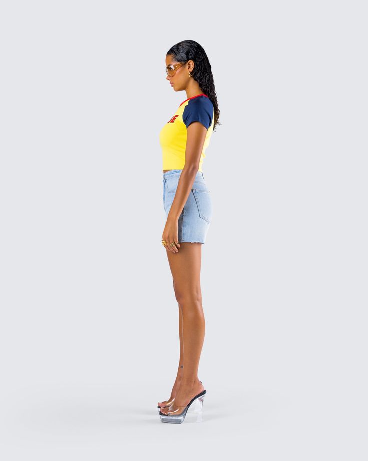 Nothing beats a casual slay 🙌 Featuring a yellow graphic jersey top and a pair of blue denim cutoff shorts, this effortless two-piece set is the perfect everyday it-girl look 💛 Casual Cotton Mini Jean Shorts, Casual Cotton Jean Shorts Mini Length, Casual Mini Length Jean Shorts For Summer, Sporty Denim Jean Shorts For Summer, Sporty Tops For Day Out, Sporty Cotton Jean Shorts For Summer, Yellow Short Tops For Summer, Yellow Short Sleeve Summer Top, Short Tops For Streetwear In Summer