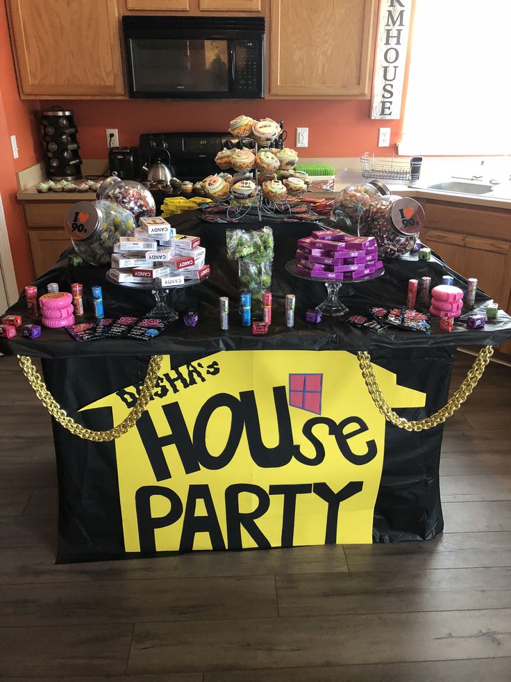 a table that has some food on top of it and is covered with a sign