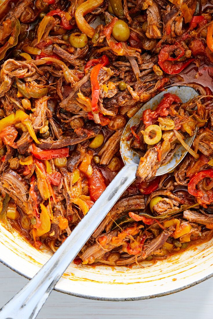 a large pot filled with meat and vegetables