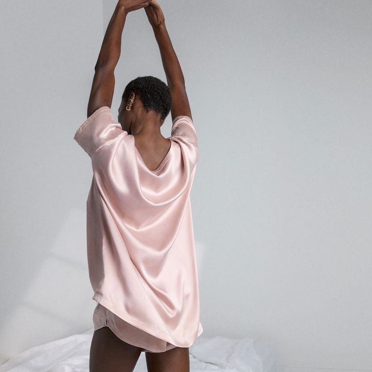 If you're constantly wrapping yourself up in your silk sheets, wait 'till you slip on this baby. Designed in an oversized relaxed fit, the Washable Silk Tee Set features clean geometric lines and a luxe look that'll have you feeling polished — even if you're on day 3 of that topknot. Body Conscious, Silk Sheets, Silk Tee, Sleep Set, Hand Chain, Short Leggings, Top Knot, Relaxed Fit, Silk