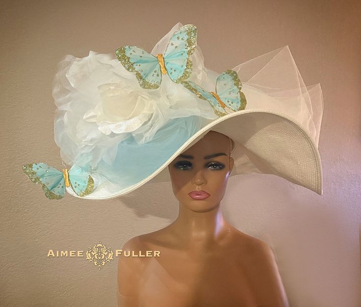 Kentucky Derby-style hat with beautiful hand-made over-sized flower (silk and velvet). Ethereal layers of crinoline AND fanciful butterflies edged in gold, and created from feathers! THIS IS a LARGE, FLOPPY HAT--we also have this design available with a stiffer sinamay base (seen in a photo in the photo gallery). Please inquire. Perfect for Derby, Gala, Prom, Weddings, Bridal, Cocktail, High Tea, Church. Looks lovely from every angle.   *FREE SHIPPING Handmade by Aimee Fuller in Southern California See more of our collection in person if you are in: San Diego Del Mar Beverly Hills La Jolla Aimee Fuller has been a trusted online seller since 1999, and is excited to bring her jewelry and hats back to Etsy.  Though often copied by hobbyists and even high-end department stores, discriminating Kentucky Derby Hats For Women, Kentucky Derby Style, Easter Hat, Large Brim Hat, Royal Ascot Hats, Derby Outfits, Big Butterfly, Ladies Who Lunch, Easter Hats