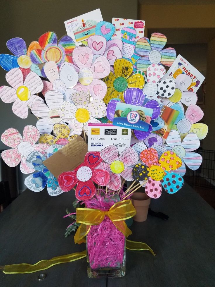 a vase filled with lots of paper hearts