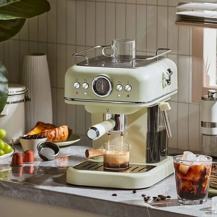 an espresso machine sitting on top of a kitchen counter