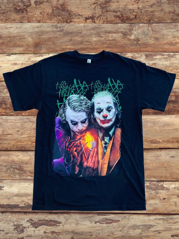 the jokers t - shirt on a wooden background