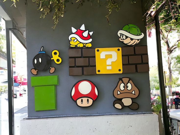 the nintendo wall is decorated with mario and luigi's characters, including toad, yoshi