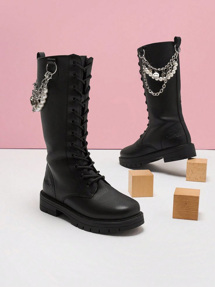 Thermoplastic Elastomers soleInterchangeable Accessories: Let kids customize their own look with the interchangeable pearl and charm chain that come along with these boots.Easy On/Off: The inner side zipper and adjustable shoelace offer a secure fit that's effortless to put on.Flexible & Durable TPR Outsole: These girls' black boots are made with a TPR outsole that offers exceptional flexibility, durability, and traction.Easy-To-Clean Upper: The PU upper is easy to clean, ensuring a hassle-free Maintenance Routine, Girls Black Boots, Skirt Sweater, Jeans Skirt, Charm Chain, Girls Black, Girls Boots, Kids Boots, Big Kid