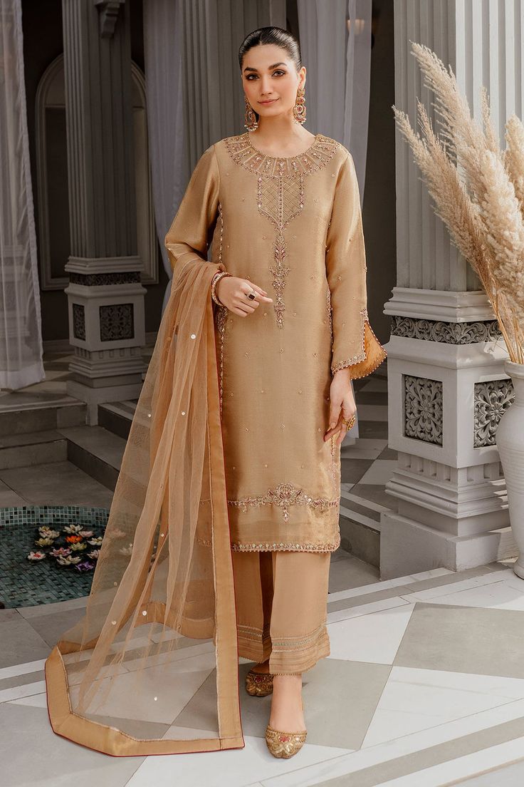 The premium Golden Embroidered Pakistani Salwar Kameez Dupatta is a perfectly stitched elegant masterpiece that has the perfect balance of royalty and grace. Semi-stitched Gold Kurta With Naqshi, Elegant Shantoon Sets With Zari Work, Traditional Gold Raw Silk Wear With Naqshi, Elegant Gold Sharara With Intricate Embroidery, Gold Palazzo Set With Zari Work For Wedding, Elegant Shantoon Sharara For Festive Occasions, Semi-stitched Gold Chanderi Lawn Suit, Gold Embroidered Palazzo Set For Wedding, Gold Traditional Wear With Naqshi Drape