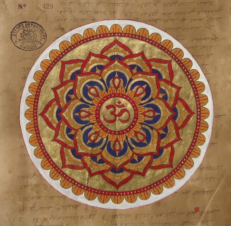 an old piece of paper that has been decorated with gold and blue designs on it