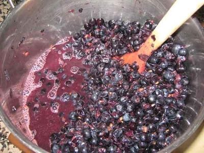 blueberries are being mixed together in a bowl