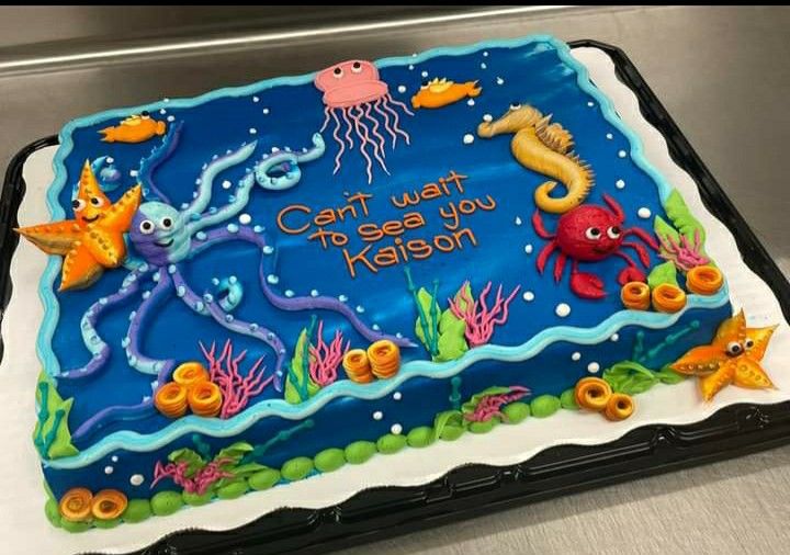 a birthday cake with an ocean theme on it