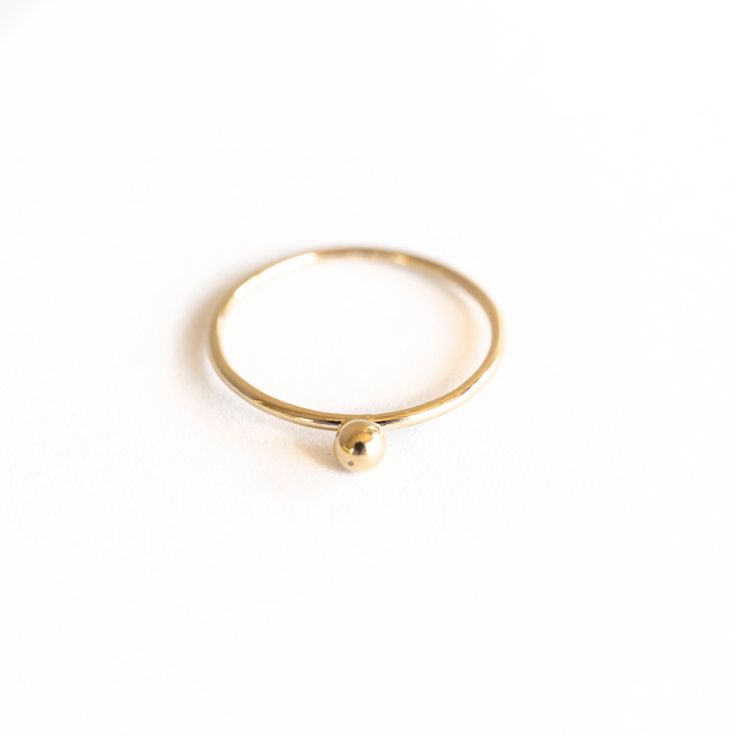 A dainty, but sturdy Single Dot Gold Ring to be worn often and treasured. • Smooth finish • Made-to-order, please allow 3-5 business days for preparation Material: 14k Gold Filled Simple Tarnish Resistant Round Band Jewelry, Simple 14k Gold Midi Rings, Everyday Tiny 14k Gold Rings, Dainty Everyday Rings Stamped 14k, 14k Gold Hammered Midi Rings, Simple 14k Gold Stackable Rings Tarnish Resistant, Hammered 14k Gold Midi Rings, Hammered 14k Gold Round Midi Rings, Simple Round Band 14k Gold Jewelry