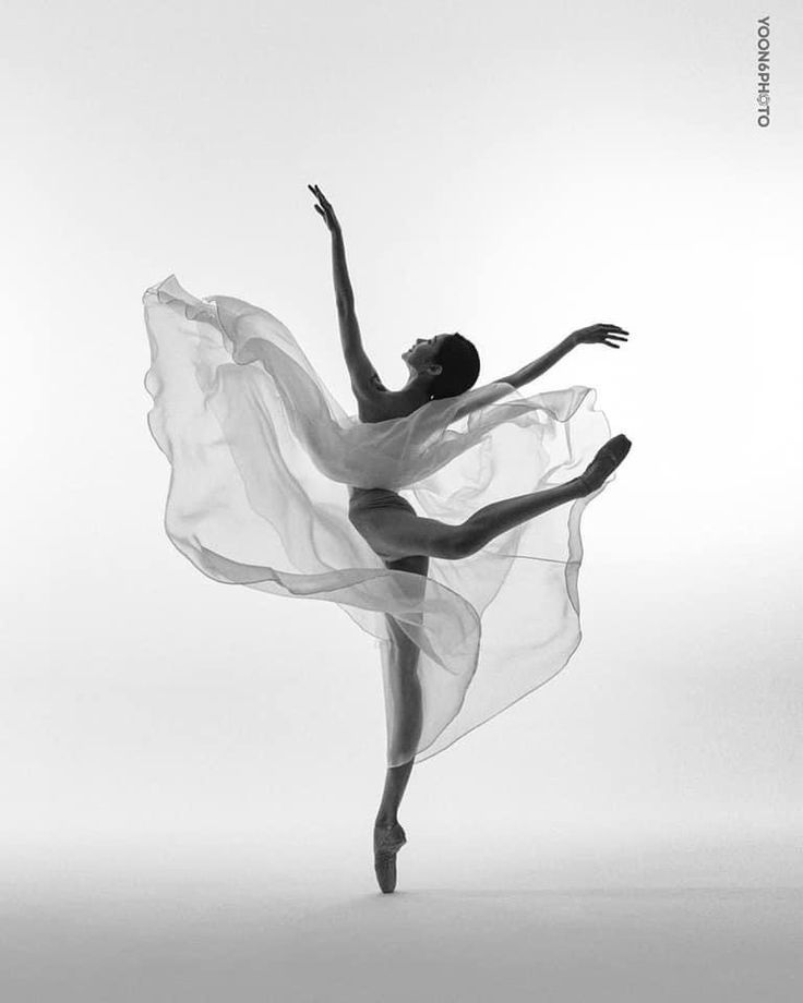 a black and white photo of a ballerina