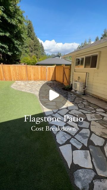 a backyard with flagstone patio and stone walkway