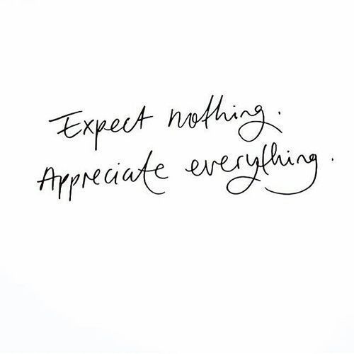 the words expect nothing appreciate everything written in cursive handwriting on a white background