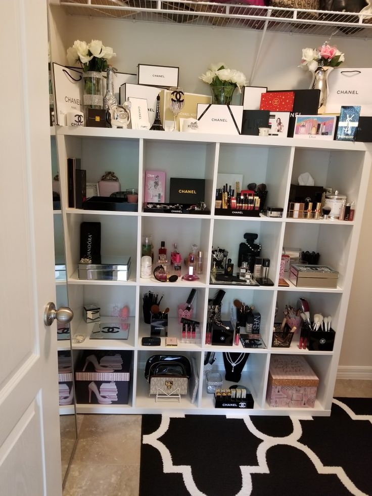 a closet filled with lots of beauty products and personal care items on shelving units