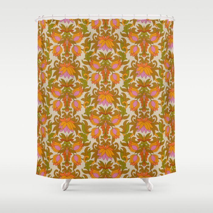 a shower curtain with an orange and pink flower pattern on it's back side