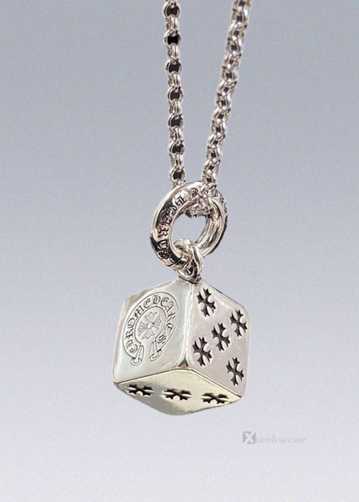 Chrome Heart Cross Dice Necklace */. FEATURES & DETAILS: The Chrome Heart Cross Dice Necklace is more than just a piece of jewelry - it's a statement of style and faith. This necklace features a beautifully crafted brand cross that serves as a symbol of faith and devotion, while the dice element adds a touch of edginess and modernity. Wear this necklace as a testament to your beliefs or as a unique accessory that adds flair to any outfit. Available in silver. Material: Stainless steel. Pa Chrome Heart Accessories, Chrome Hearts Necklace, Crochet With Wire, Elven Tree, Dice Necklace, Dice Jewelry, Dice Tattoo, Chrome Hearts Jewelry, Expensive Jewelry Luxury