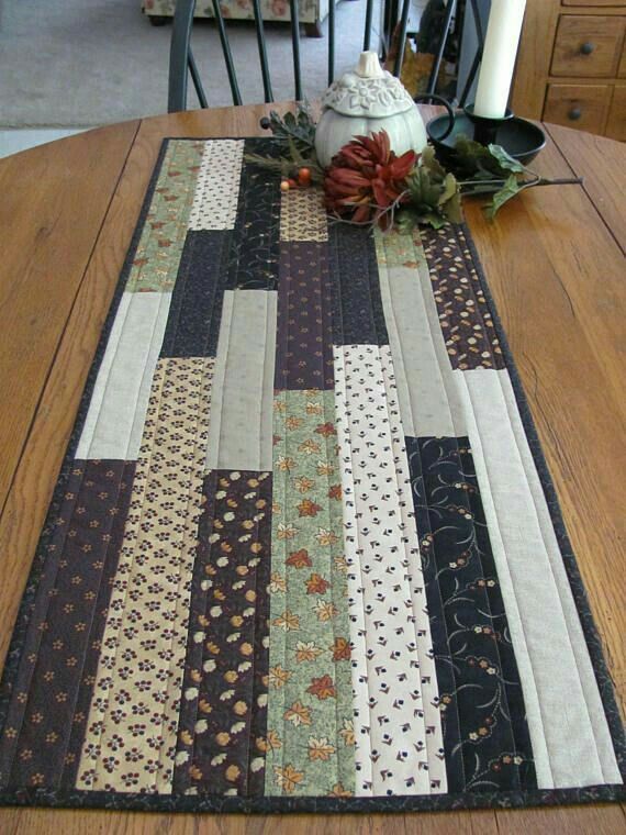 a table runner with flowers on top of it