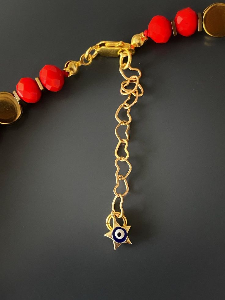 Christmas Evil Eye Necklace I believe every symbol and color has deep meaning and positive energy, and I conveyed that with the design of this necklace.Protective powers of the evil eye combined with the powerful red color. The Evil Eye bead is a prominent symbol in Turkish and many other cultures, and is highly protective. Evil Eye is also called nazar. Evil Eye beads reflect ill intent and jealousy from the 'evil eye' back to the person thinking of it, hence protecting the wearer. They also br Red Carnelian Amulet Necklace, Symbolic Gemstone Bead Necklaces For Gifts, Red Spacer Beads Jewelry As Gift, Red Spacer Beads Jewelry Gift, Red Amulet Beaded Necklaces With Colorful Beads, Handmade Red Evil Eye Bracelet For Festival, Gift Evil Eye Bracelet With Gemstone Beads, Evil Eye Bracelet With Gemstone Beads As Gift, Red Bohemian Beaded Bracelets With Evil Eye