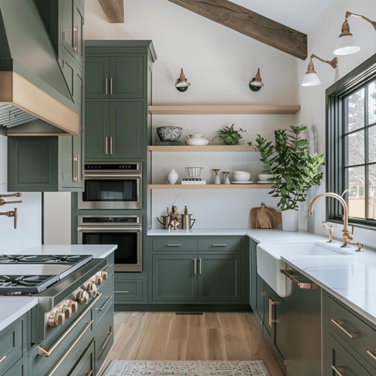 a large kitchen with green cabinets and white counter tops, along with wooden flooring