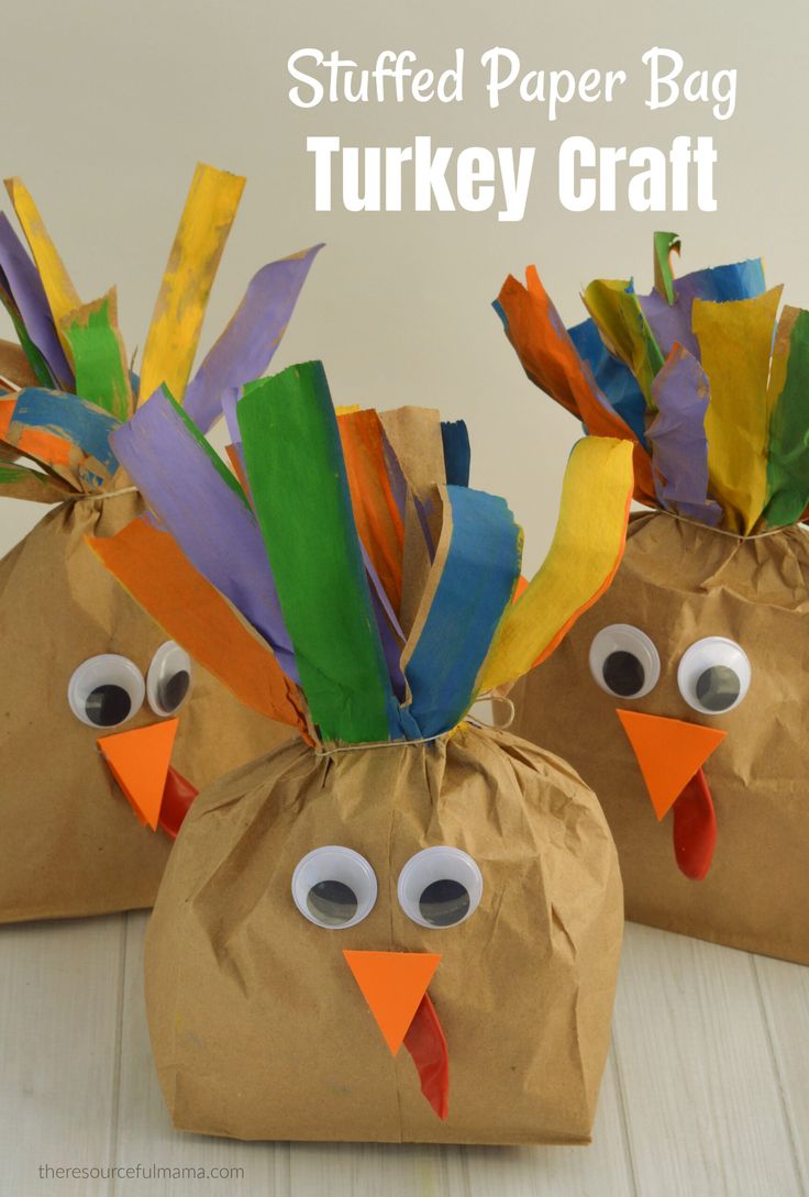 two turkey bags with googly eyes on them and the words stuffed paper bag turkey craft