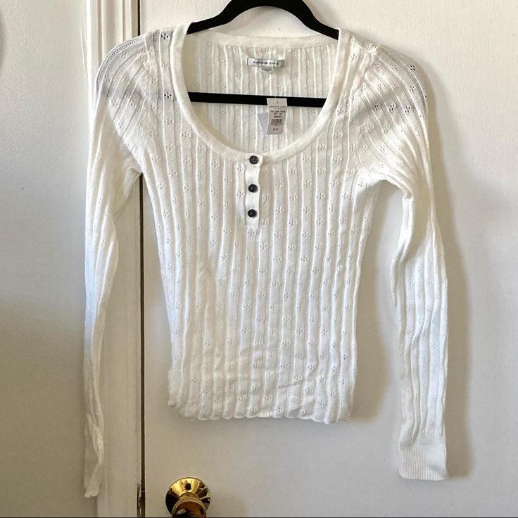 Nwt American Eagle Cropped Sweater, Long Sleeved, In A Light Cream/Almost White Color. All Buttons Fully Attached (With Spare Button Included). Approx 15” From Bottom Of Neckline To Bottom Of Shirt. Please Let Me Know If You Have Any Questions! Cream Button Up Sweater, White Sweater, Three Quarter Sleeve Shirt, American Eagle Crop Top, Gilmore Girls Outfits, Thrift Store Outfits, Sheer Long Sleeve Top, American Eagle Sweater, Long Sleeve Knit Tops