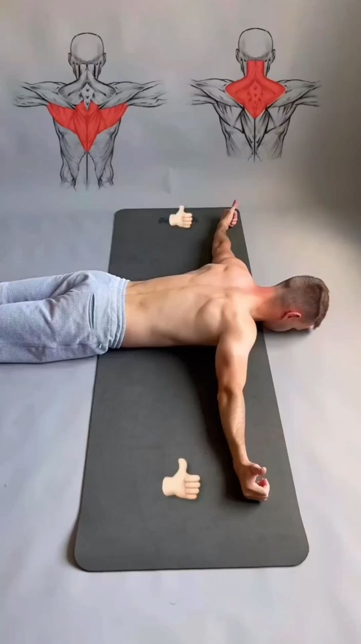 a man laying on top of a yoga mat in front of his back and muscles