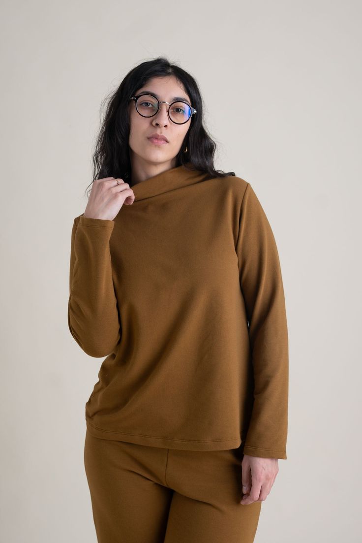 Versatile High Neck Top For Fall, Fall Funnel Neck Workwear Top, Funnel Neck Tops For Fall Workwear, Relaxed Fit Long Sleeve Turtleneck For Work, Versatile Turtleneck Long Sleeve Top For Fall, Versatile Long Sleeve Mock Neck Top For Work, Fall Turtleneck Blouse For Work, Versatile Funnel Neck Top For Fall, Fall Long Sleeve Turtleneck For Everyday