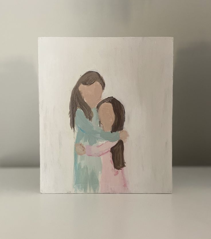 a painting of two people hugging each other on a white surface with grey walls behind them