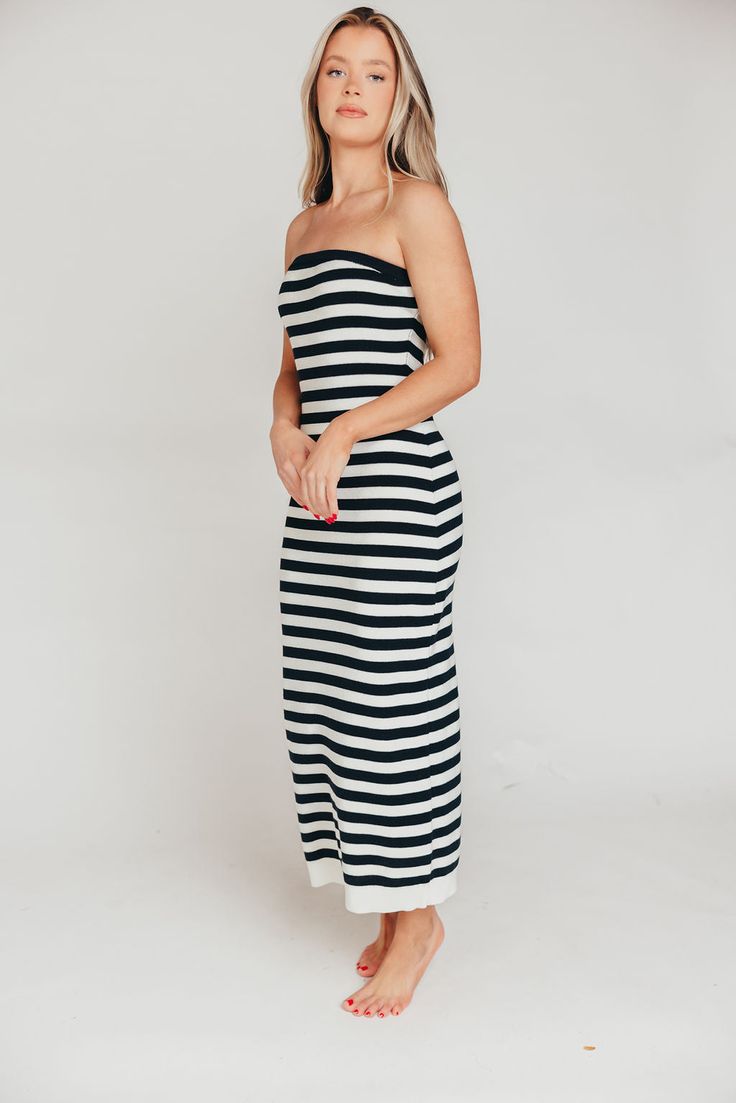 This dress is a summer must-have, whether you're looking forward to a cruise, a week of island-hopping in the Mediterranean, or a staycation at the neighbor's pool! The Eventide Maxi Dress is crafted from a comfortable cotton blend and features a slimming, strapless silhouette. Pair it with slides or tennis shoes for sightseeing, or with wedges for dinner at the resort! FIT: Runs true to size - fitted. MODEL: Model is 5’7” / wearing a small. MATERIAL: 48% Cotton, 40% Acrylic, 12% Nylon. GARMENT Casual Strapless Dress For Poolside, Summer Strapless Dress For Beach Cover-up, Strapless Summer Dress For Beach Cover-up, Strapless Summer Dress For Poolside, Strapless Beachwear Dress For Poolside, Summer Strapless Midi Dress For Vacation, Chic Striped Dress For Beach Season, Strapless Summer Midi Dress, Casual Midi Dress For Poolside