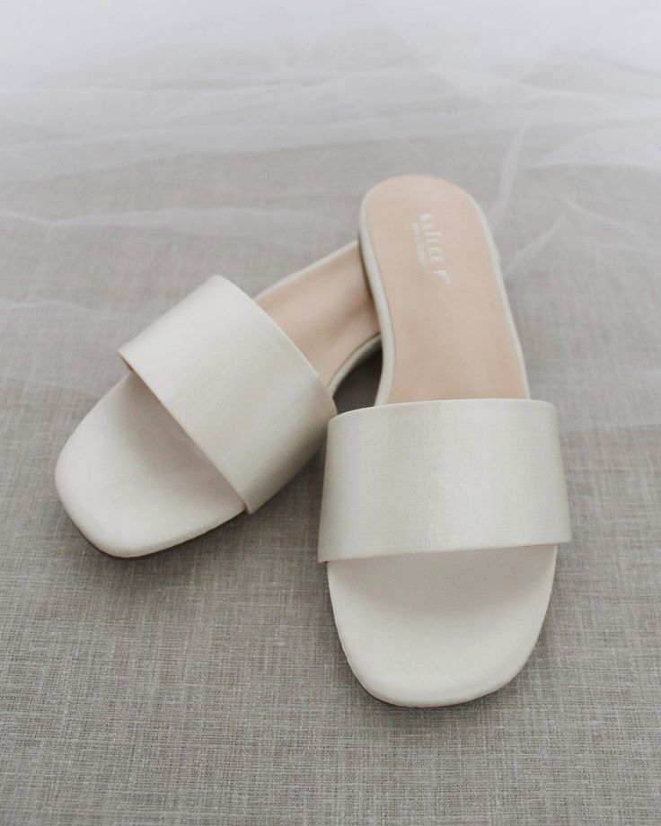 Classic slide flat sandals for casual and dressy look. Simple and easy wear for brides, bridesmaids and wedding parties.DETAILS:COLORS AVAILABLE: Ivory, Light Blue, White, Pink, and ChampagneUPPER: Synthetic upper and liningMATERIALS: Mandmade outsole STYLE NAME: EVELYN Flats For Wedding, Wedding Afterparty, Bridesmaid Sandals, Ivory Flats, Wedding After Party, Slip On Sandals, Wedding Parties, Satin Slip, Dress Ideas